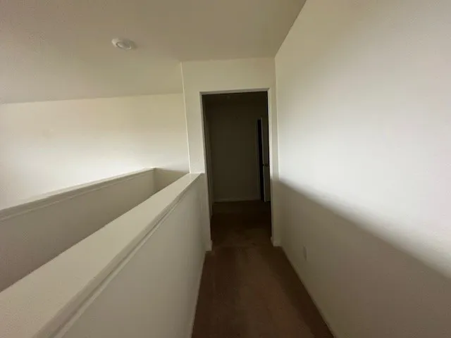 a bathroom with a double vanity sink and mirror