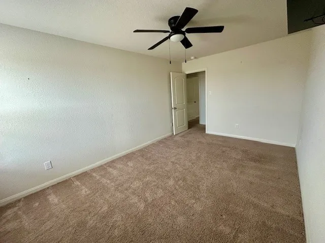 a view of a big room with carpet