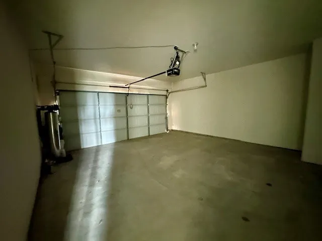 a view of a sign in front of a house with a big yard