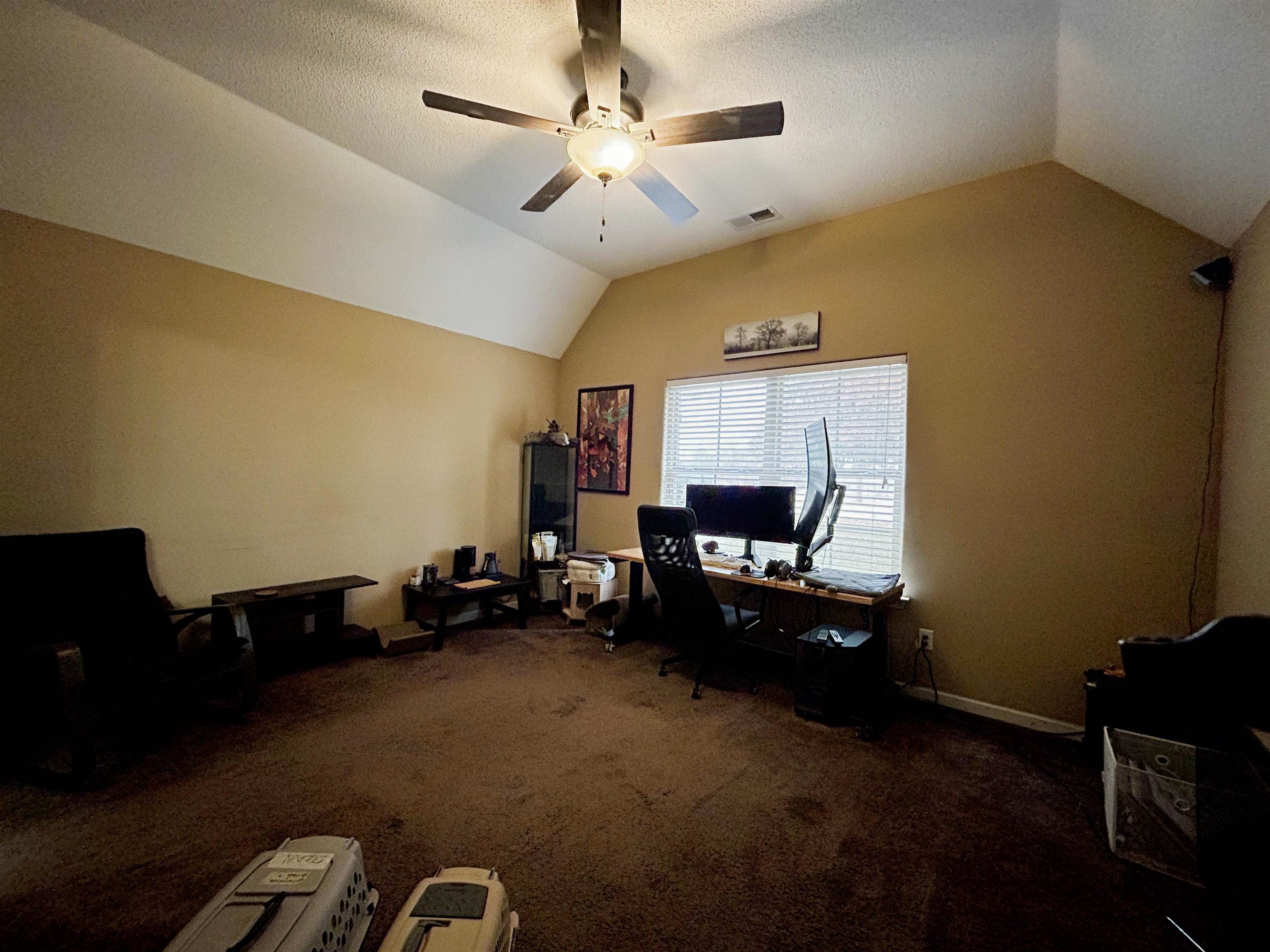 7927 Lowrance Road Memphis, TN 38125 - Photo 7 of 13 Office featuring lofted ceiling, dark carpet, a ceiling fan, and a textured ceiling
