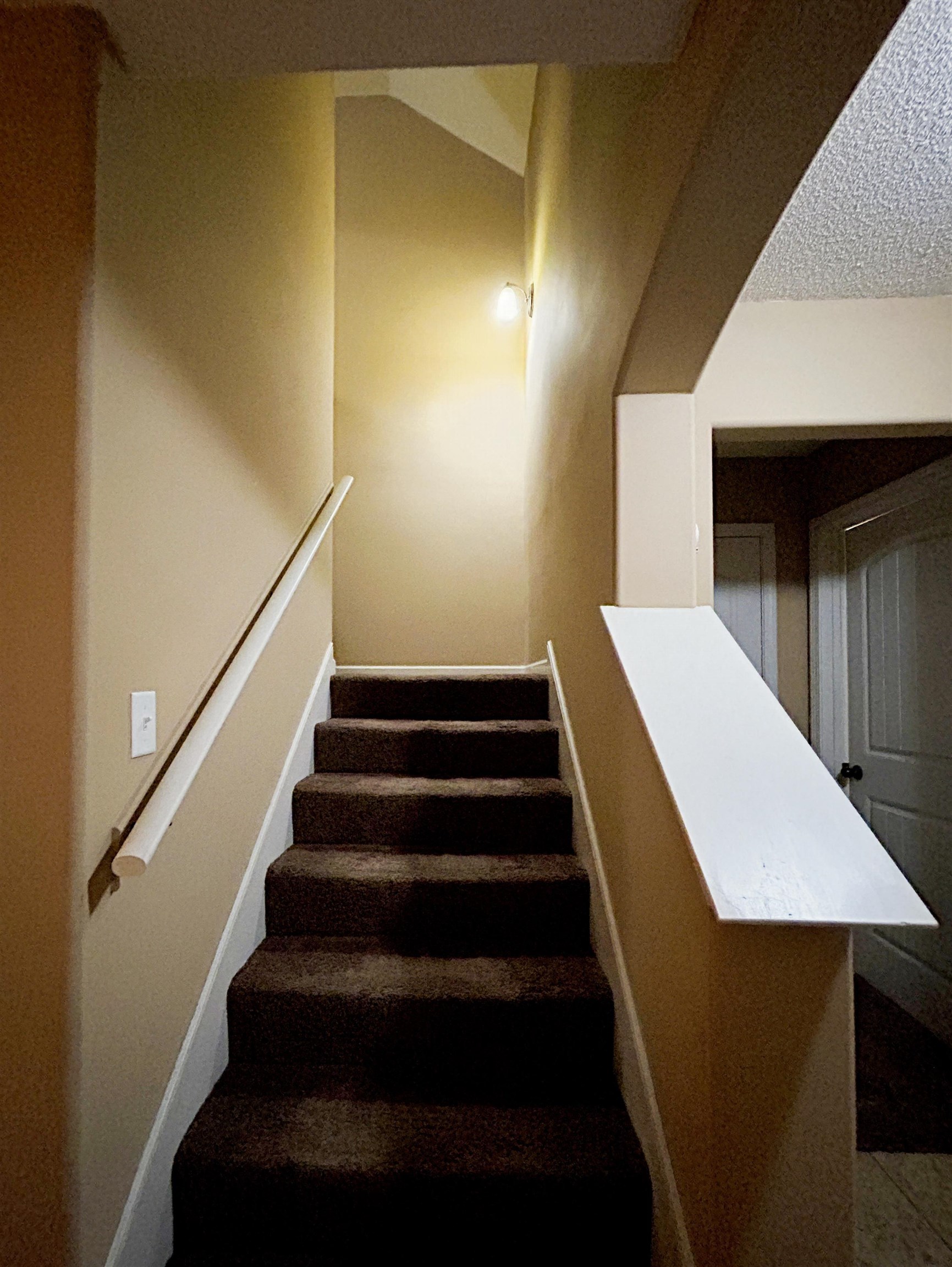 7927 Lowrance Road Memphis, TN 38125 - Photo 9 of 13 Stairs featuring a textured ceiling