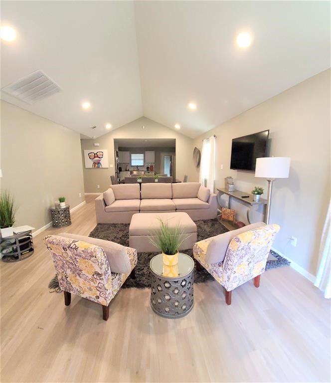 1727 Pueblo Street Dallas, TX 75212 - Photo 4 of 27 a living room with furniture and a flat screen tv