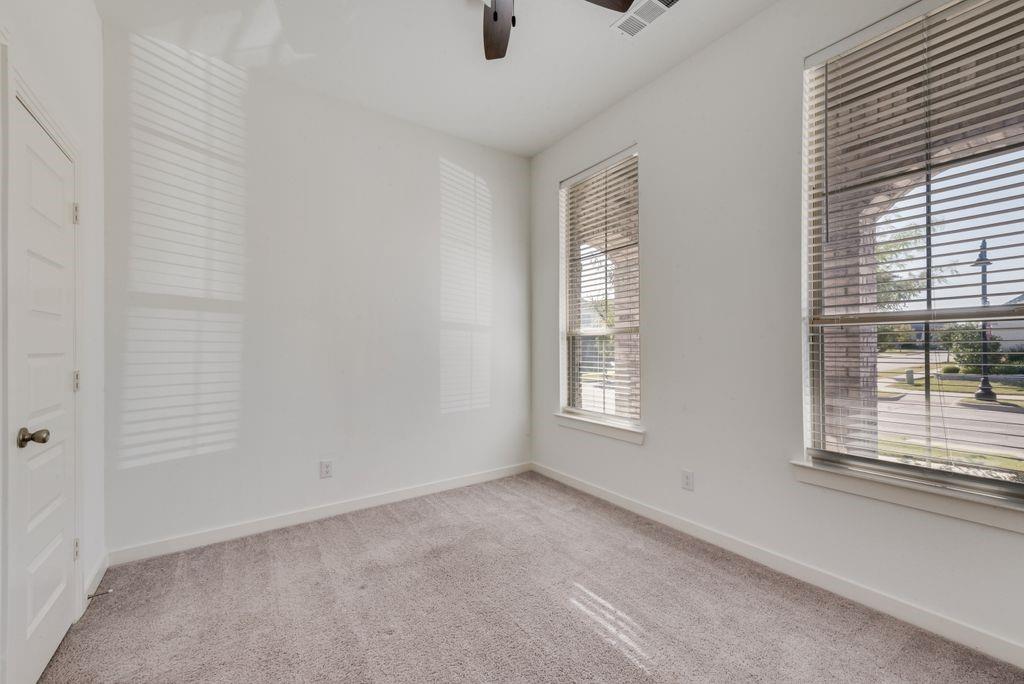 7001 Spring Park Drive Little Elm, TX 76227 - Photo 18 of 38 a view of an empty room with a window
