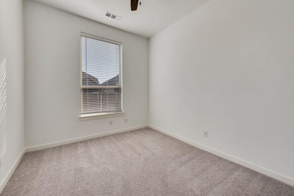 7001 Spring Park Drive Little Elm, TX 76227 - Photo 20 of 38 a view of an empty room with a window