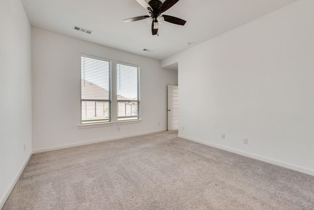 7001 Spring Park Drive Little Elm, TX 76227 - Photo 23 of 38 a view of an empty room with a window