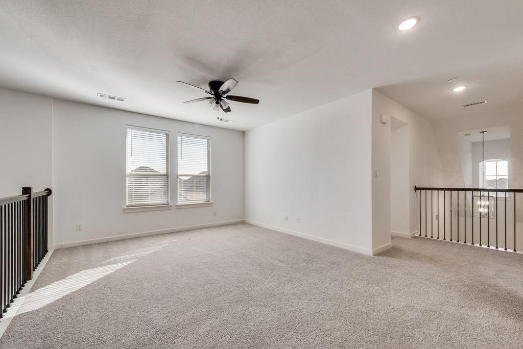 7001 Spring Park Drive Little Elm, TX 76227 - Photo 26 of 38 a view of an empty room with a window