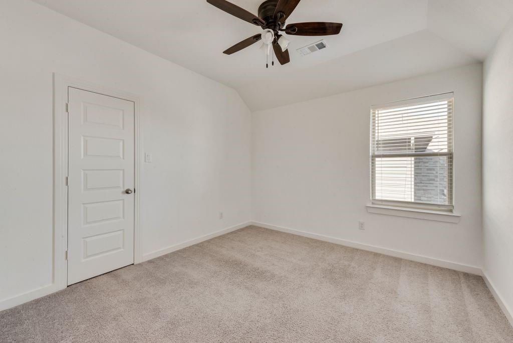 7001 Spring Park Drive Little Elm, TX 76227 - Photo 31 of 38 wooden floor in an empty room with a window