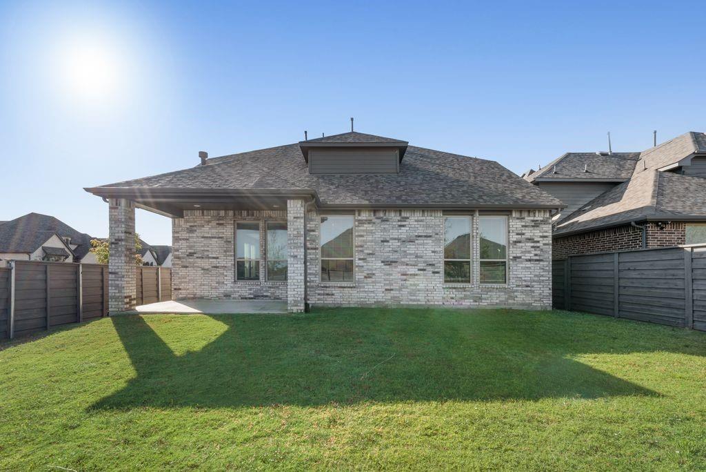 7001 Spring Park Drive Little Elm, TX 76227 - Photo 38 of 38 a view of a house with a backyard
