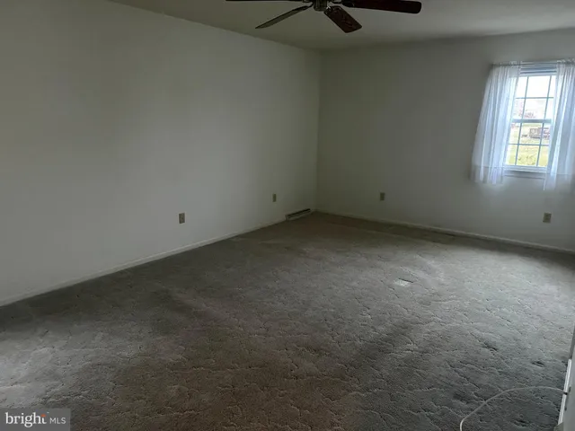 a white toilet sitting next to a sink