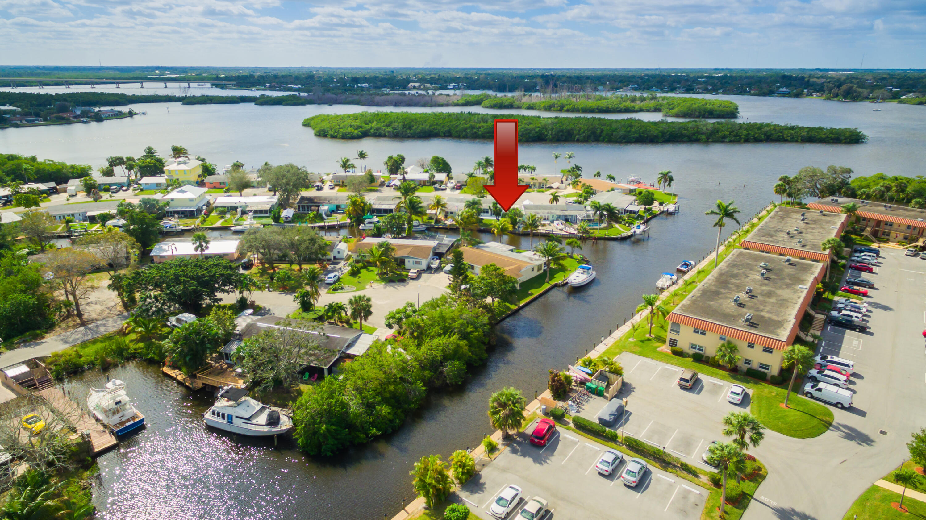 2406 Southwest Hideaway Lane Stuart, FL 34994 - Photo 1 of 39 2106 SW Hideaway Place Aerials-1_arrow
