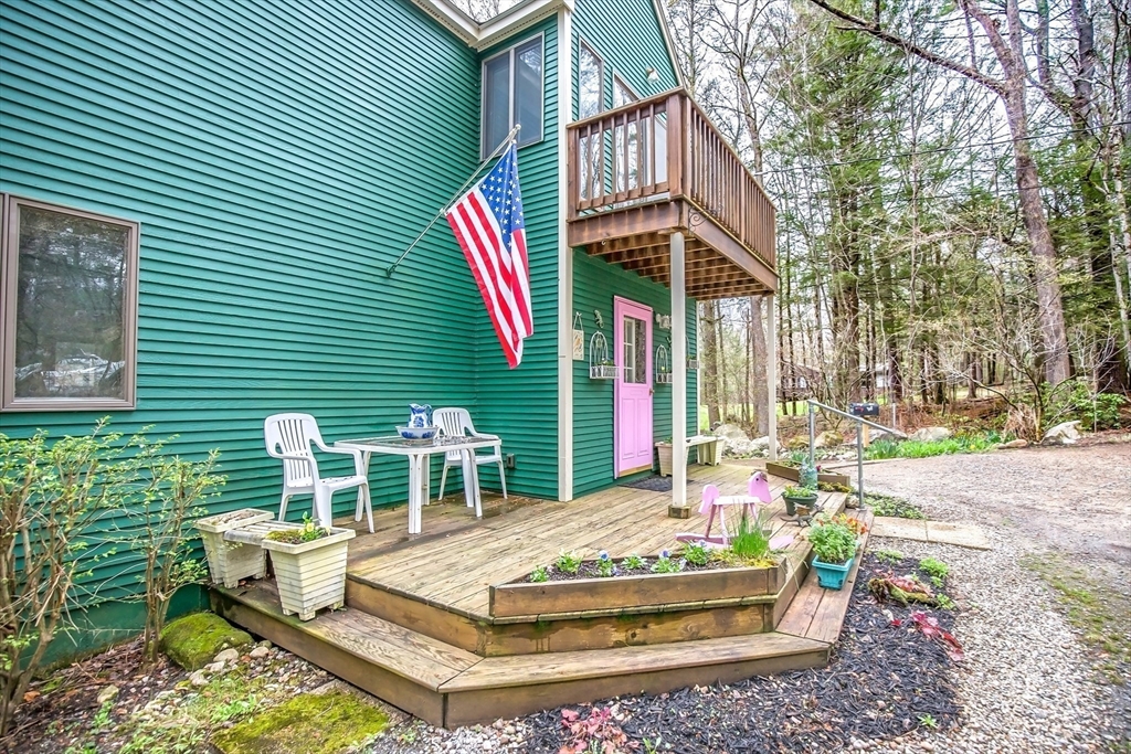 32 Woodchuck Hollow Road Tolland, MA 01034 - Photo 14 of 41 a view of a house with backyard and sitting area