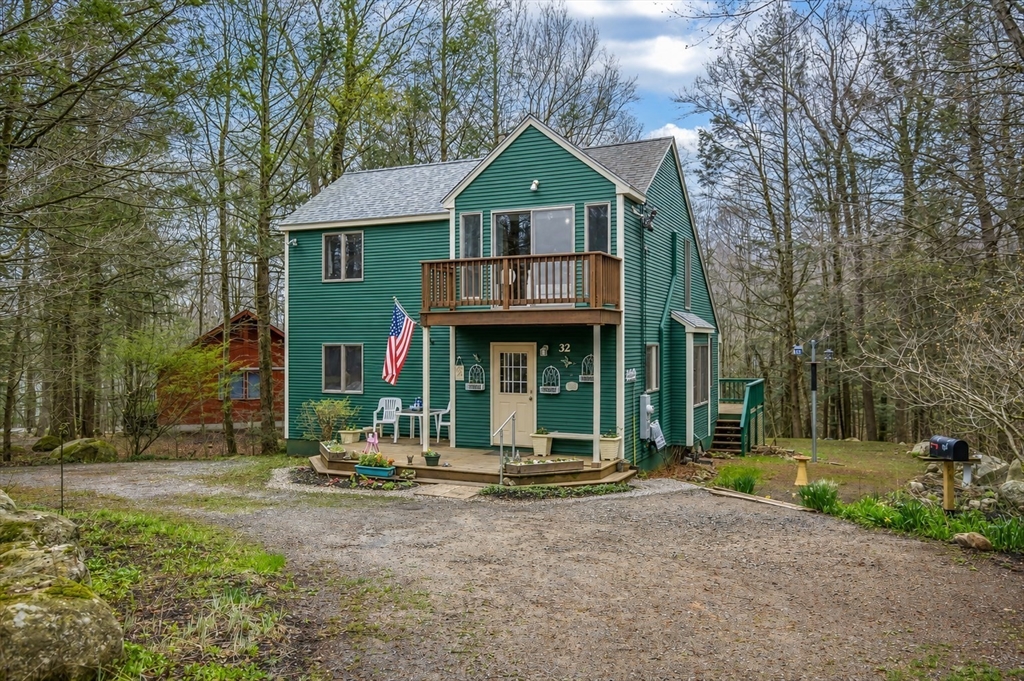 32 Woodchuck Hollow Road Tolland, MA 01034 - Photo 2 of 41 a front view of a house with garden