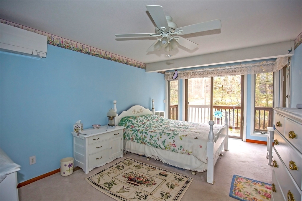 32 Woodchuck Hollow Road Tolland, MA 01034 - Photo 30 of 41 a bedroom with a bed and a window