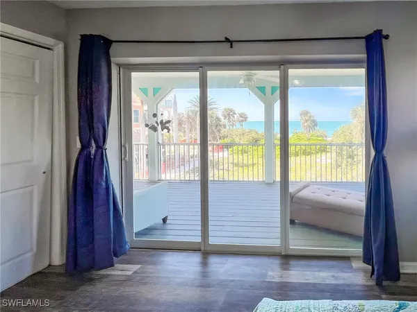 a bedroom with two beds and a window