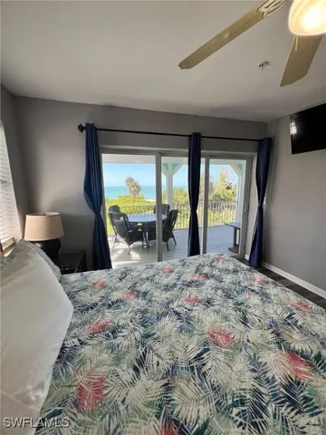 a view of a balcony with table and chairs