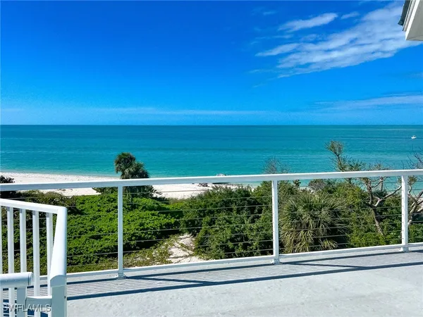 a view of a balcony with lake view