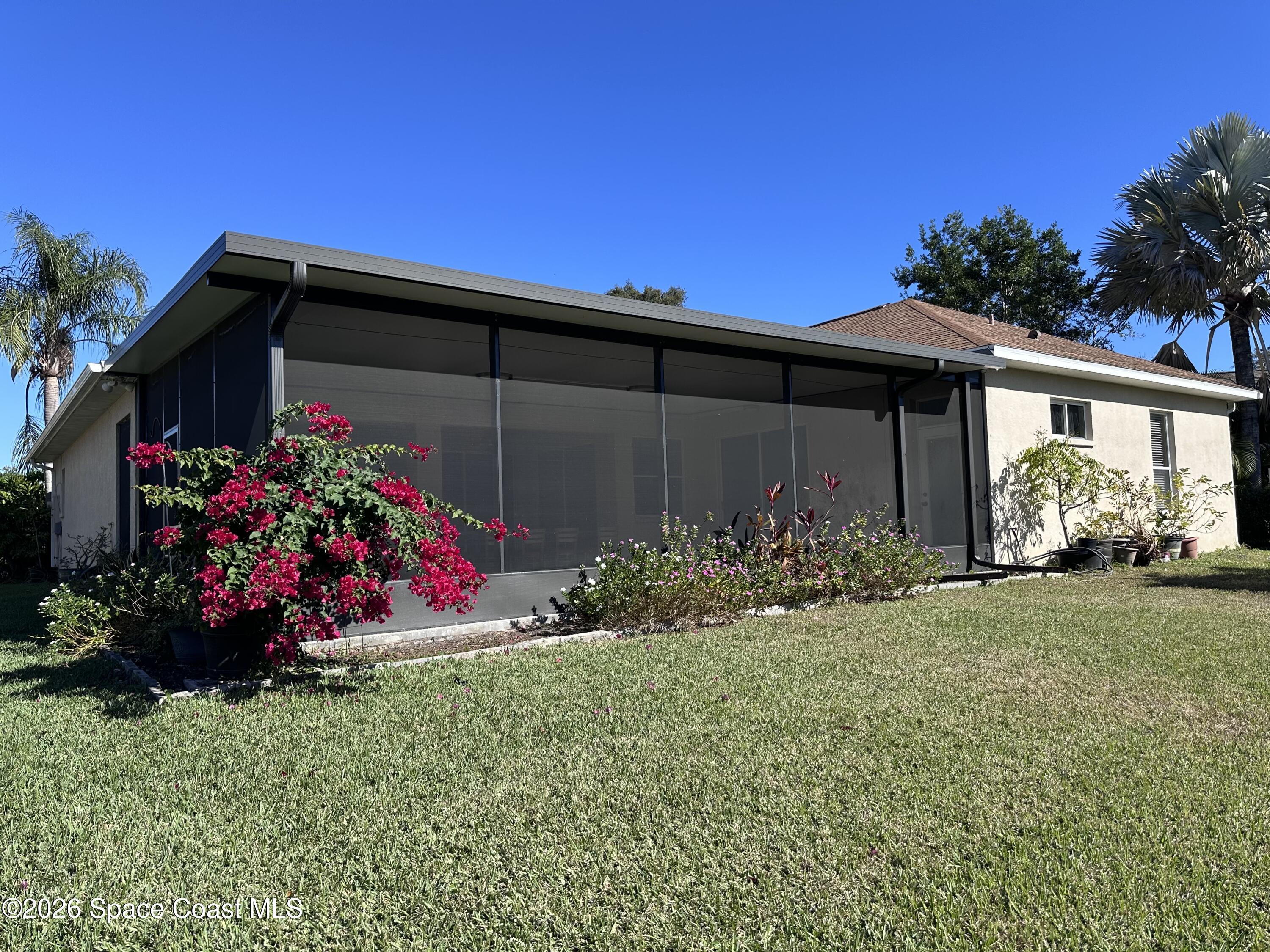 883 Spring Oak Drive Melbourne, FL 32901 - Photo 43 of 45 a view of a house with a yard