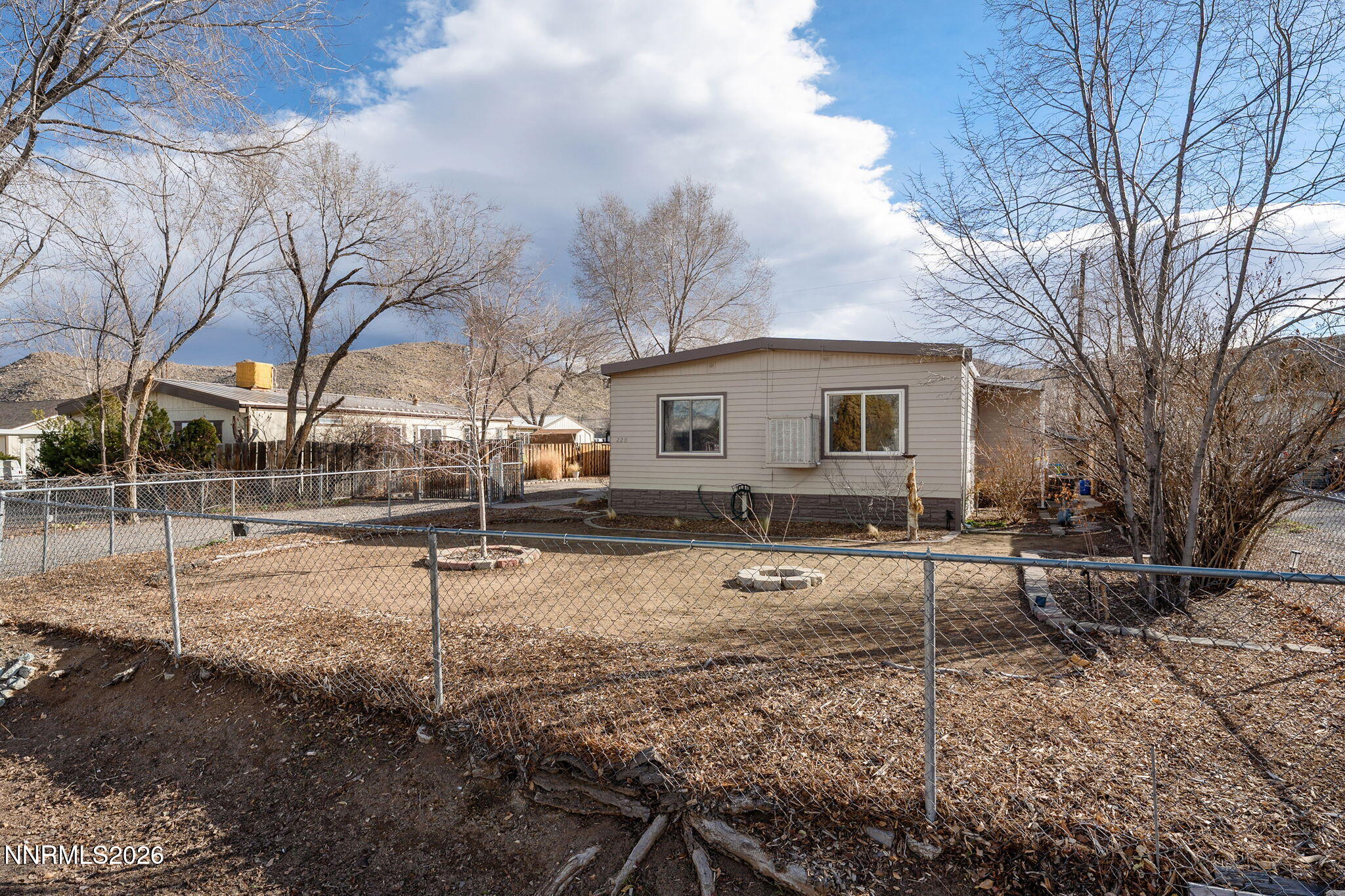 220 Aristocrat Way Reno, NV 89506 - Photo 16 of 35 a backyard of a house with wooden fence