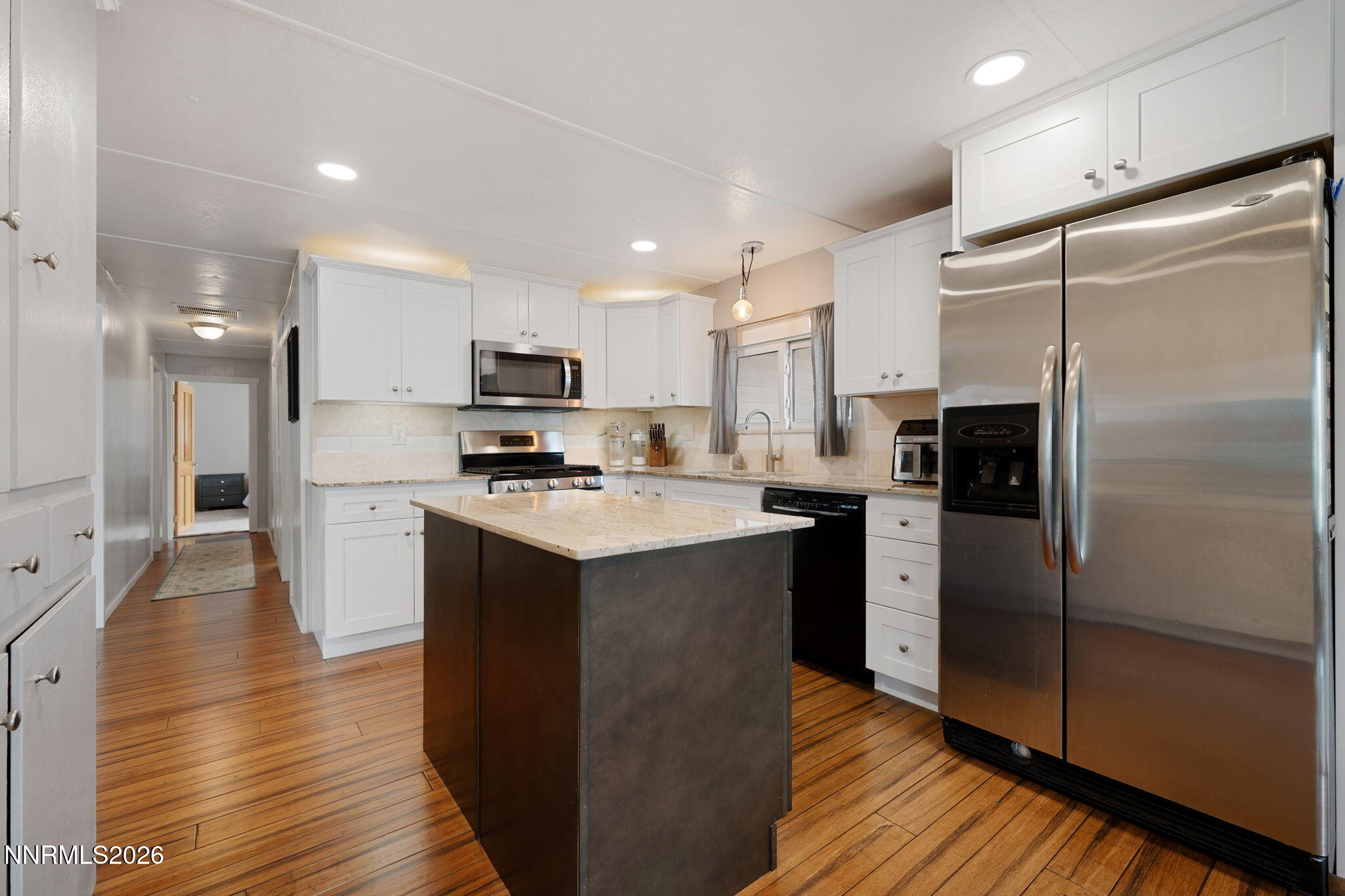 220 Aristocrat Way Reno, NV 89506 - Photo 20 of 35 a kitchen with stainless steel appliances a refrigerator sink and microwave