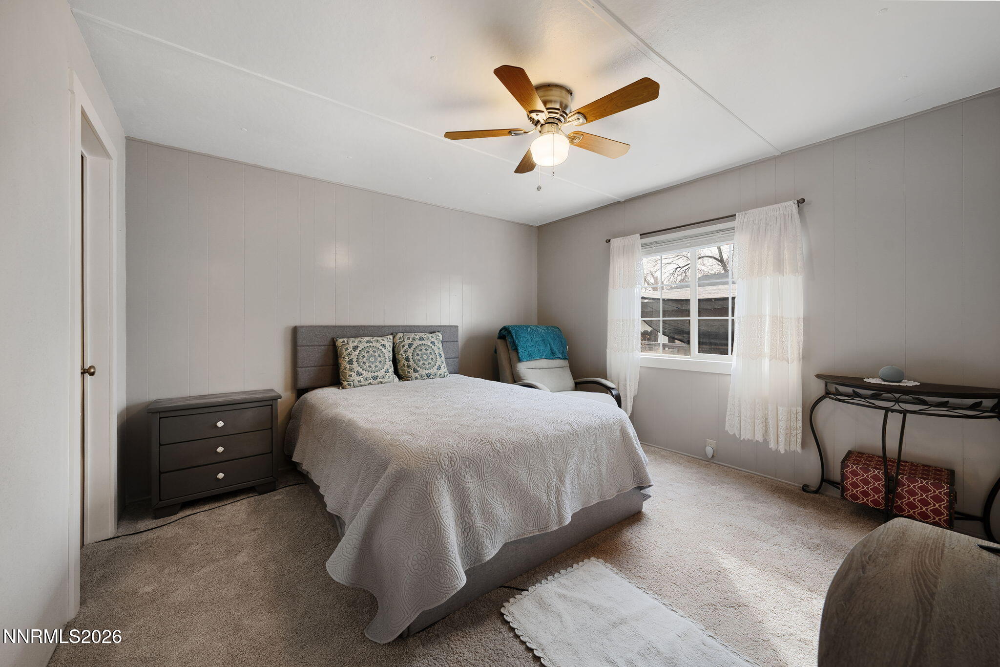 220 Aristocrat Way Reno, NV 89506 - Photo 32 of 35 a bedroom with a bed a window and dresser