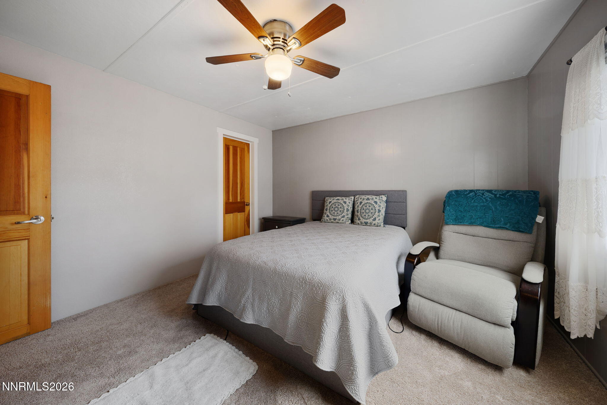 220 Aristocrat Way Reno, NV 89506 - Photo 33 of 35 a bedroom with a bed and a ceiling fan