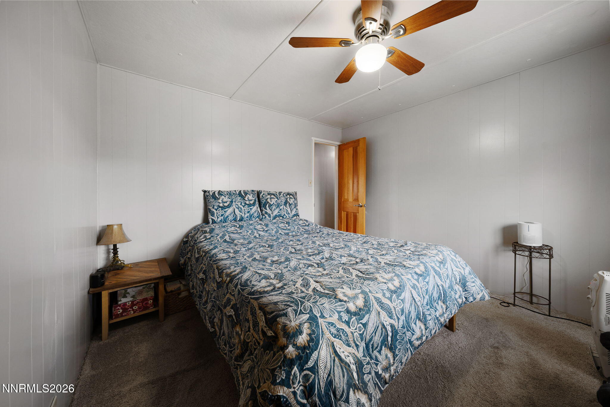 220 Aristocrat Way Reno, NV 89506 - Photo 35 of 35 a bedroom with a bed and a chandelier