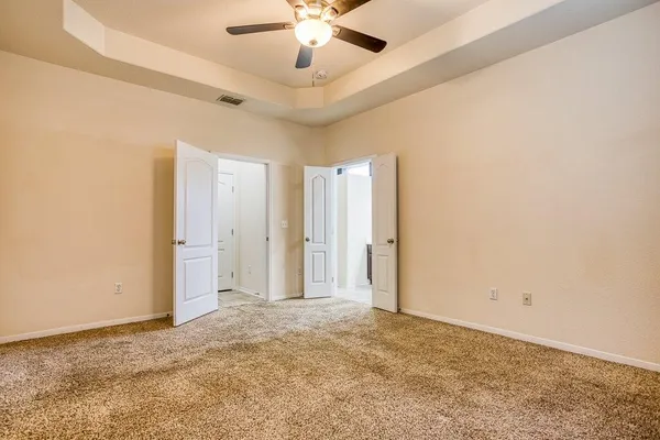 a view of a livingroom with a ceiling fan