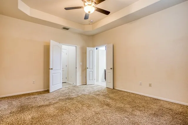a view of a livingroom with a ceiling fan