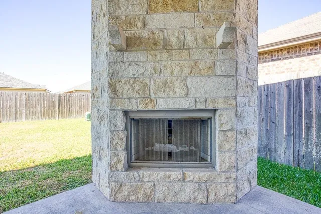 a view of a fireplace with a sitting area