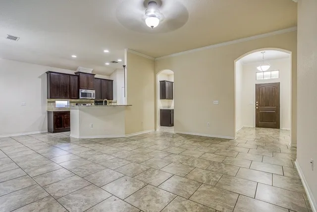 a view of kitchen with microwave and cabinets