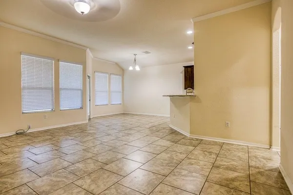 a view of a kitchen with a sink and a window