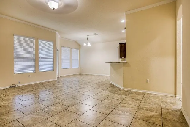 a view of a kitchen with a sink and a window