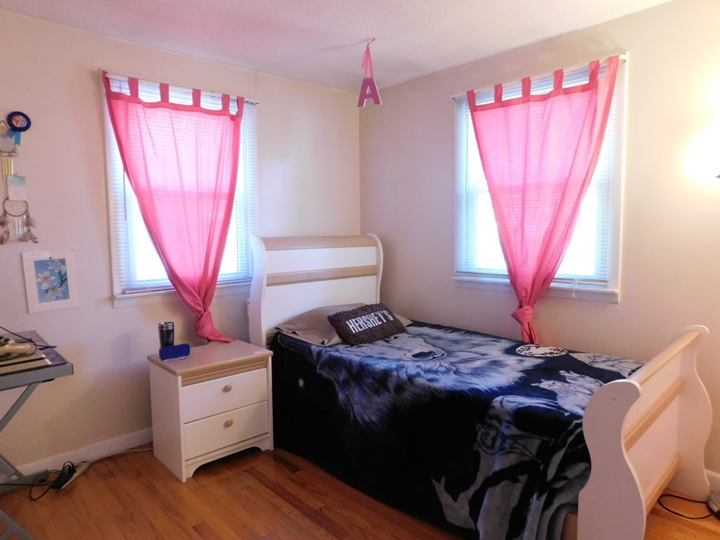 96 Laurence Street Springfield, MA 01104 - Photo 12 of 21 a bedroom with a bed and a window