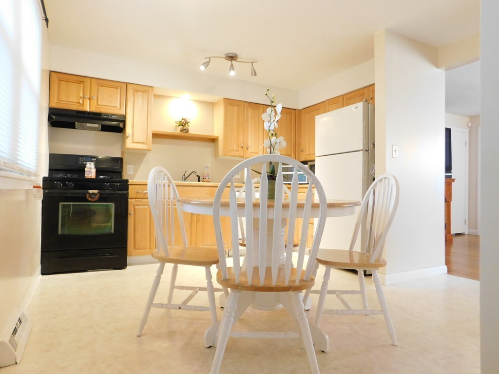 96 Laurence Street Springfield, MA 01104 - Photo 6 of 21 a view of a dining room with furniture and a window