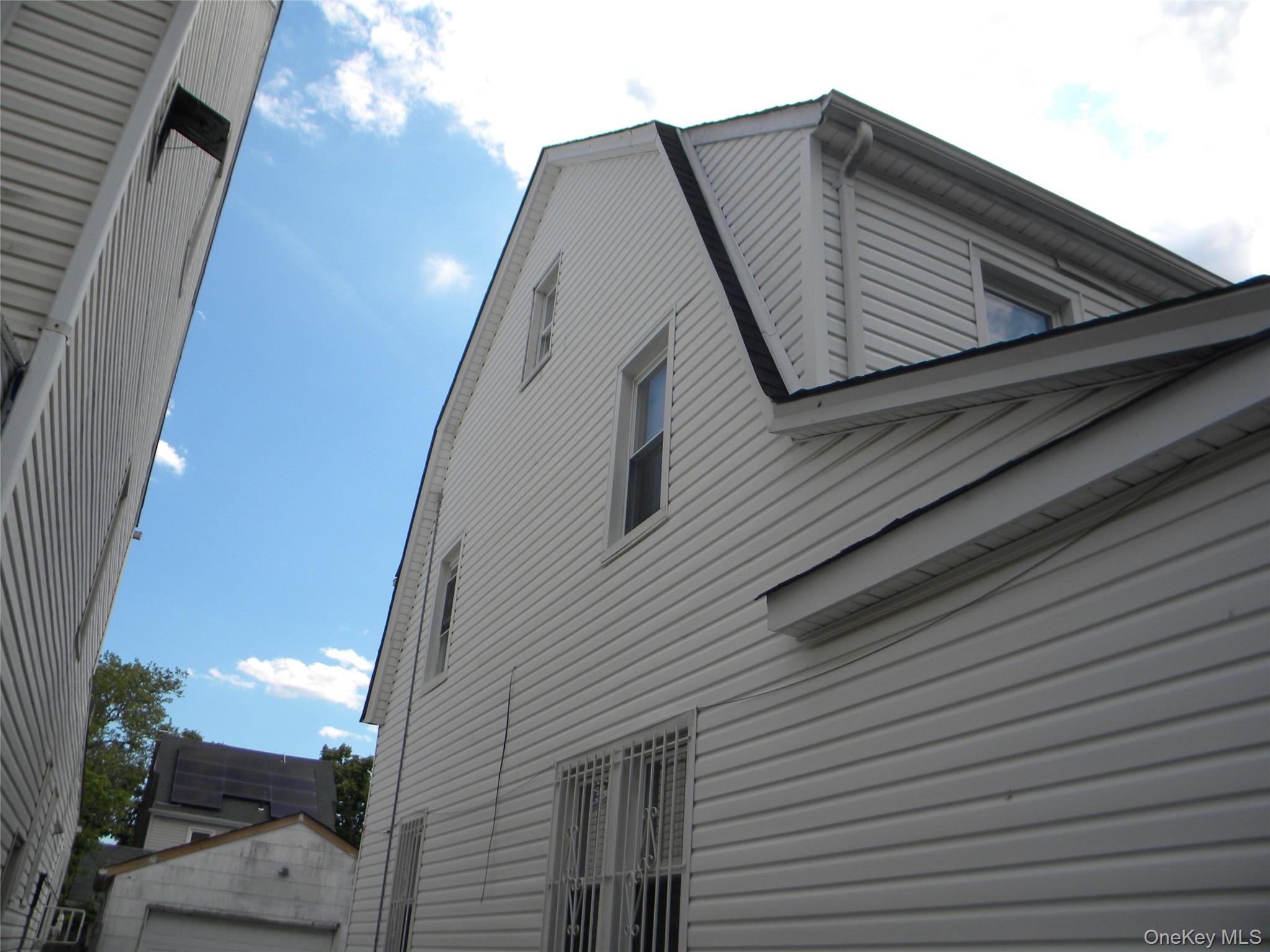 241-26 86th Road Queens, NY 11426 - Photo 2 of 38 a close up of a house