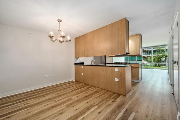 a kitchen with stainless steel appliances wooden cabinets and a counter top space