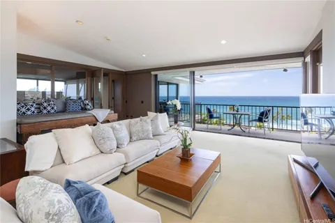 a living room with furniture and a table
