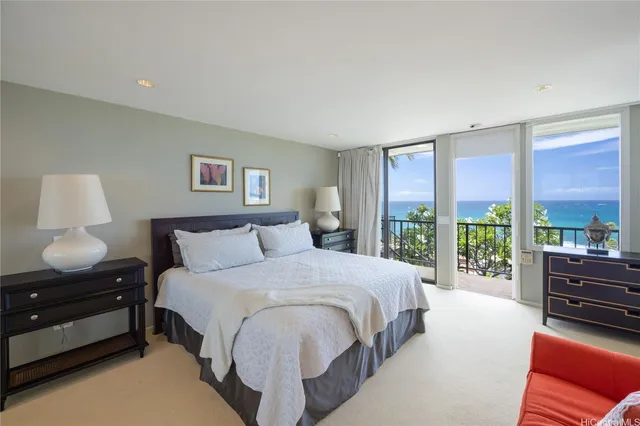 a bedroom with a bed and glass window