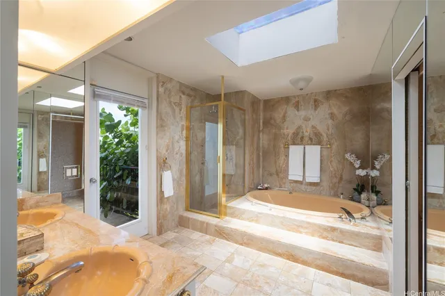 a view of a bathroom with a tub shower and windows