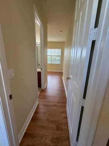 a view of gallery with wooden floor