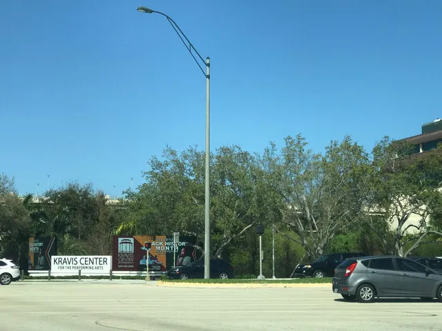 a view of street with parked cars