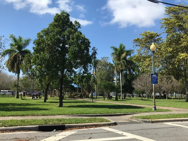 a yard with lots of trees and flowers