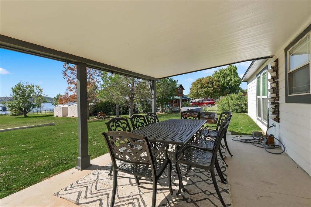 4433 Chapel Road Graham, TX 76450 - Photo 14 of 32 a view of an outdoor dining space with furniture and garden