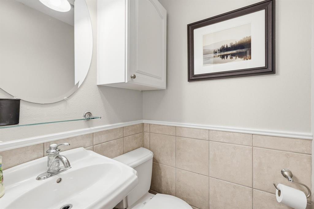 4433 Chapel Road Graham, TX 76450 - Photo 24 of 32 a bathroom with a sink and a mirror
