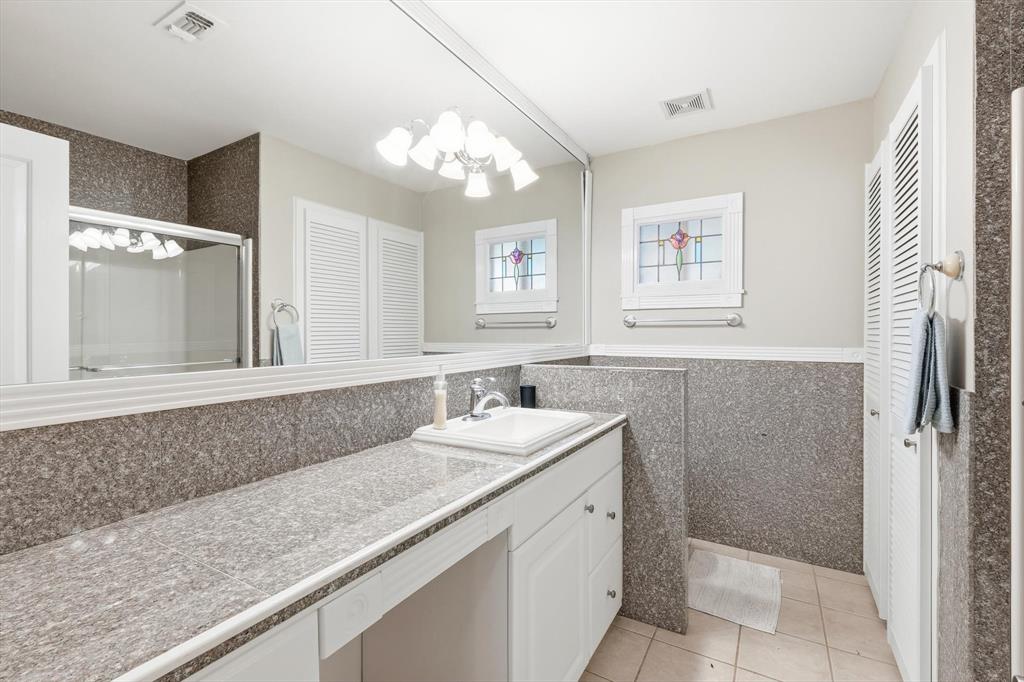 4433 Chapel Road Graham, TX 76450 - Photo 26 of 32 a bathroom with a sink a vanity and a mirror