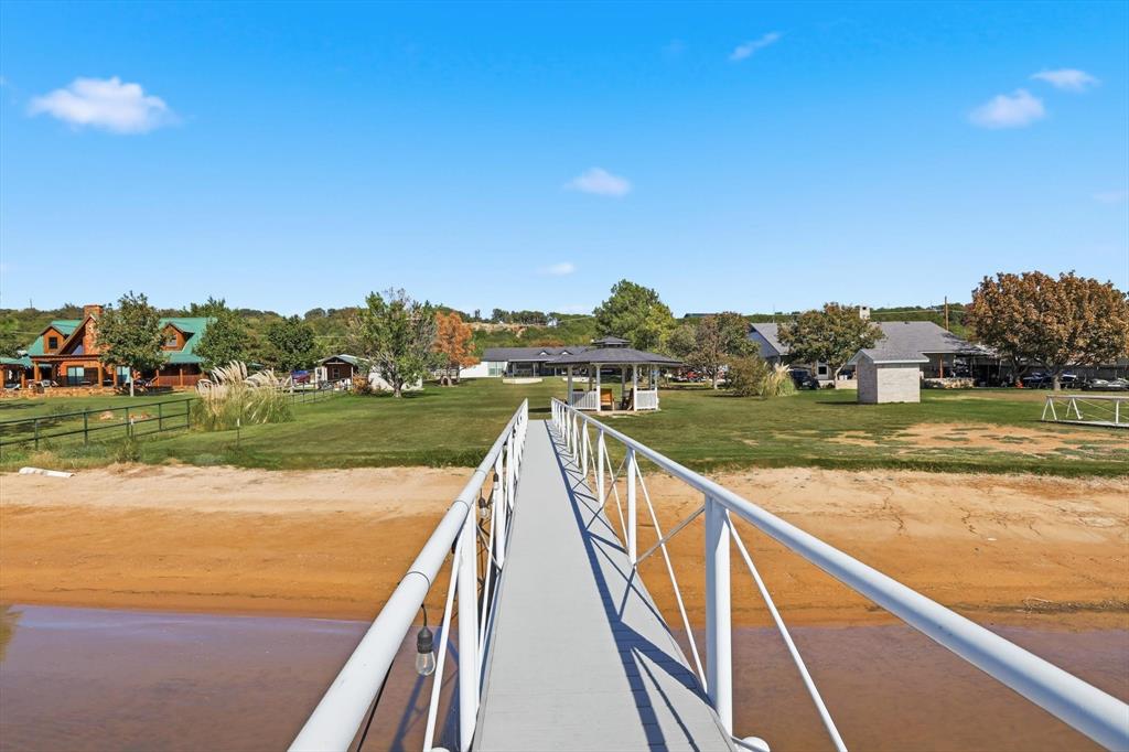 4433 Chapel Road Graham, TX 76450 - Photo 7 of 32 a view of swimming pool with a lake