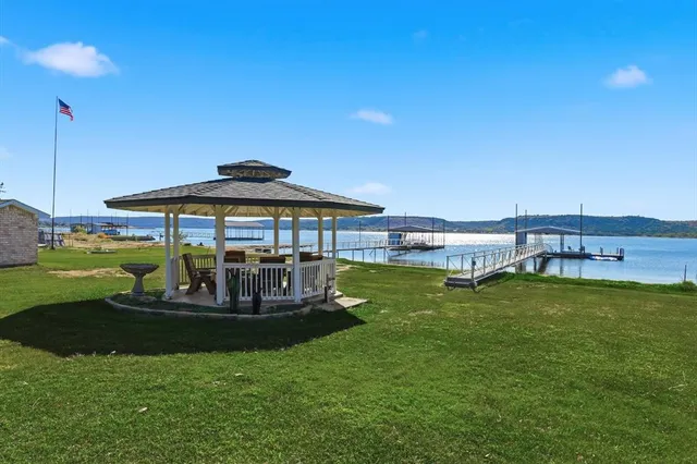 a swimming pool view with a seating space
