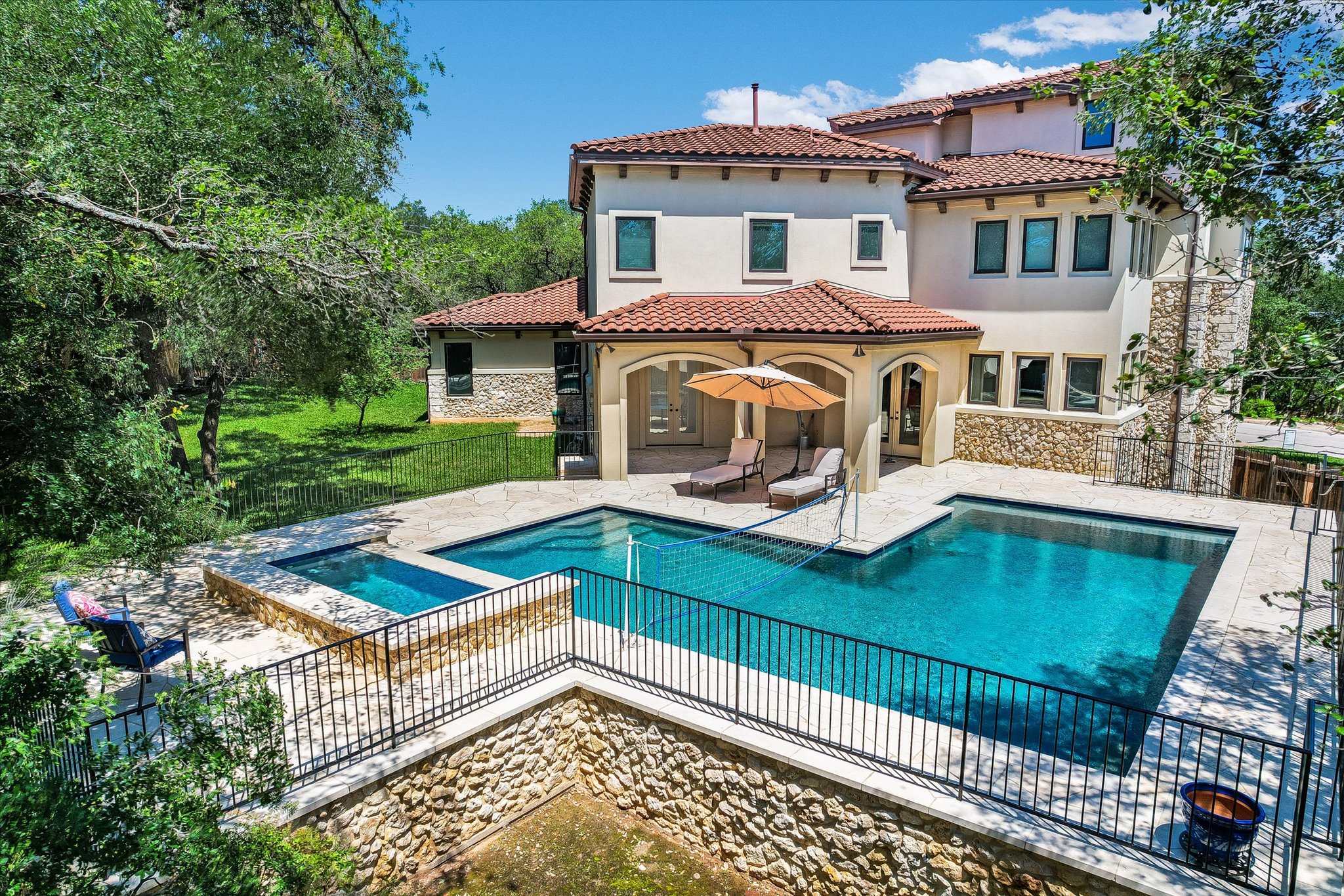 11 Inwood Circle Austin, TX 78746 - Photo 34 of 38 An inviting pool and spa beckon from the private patio of this elegant residence.