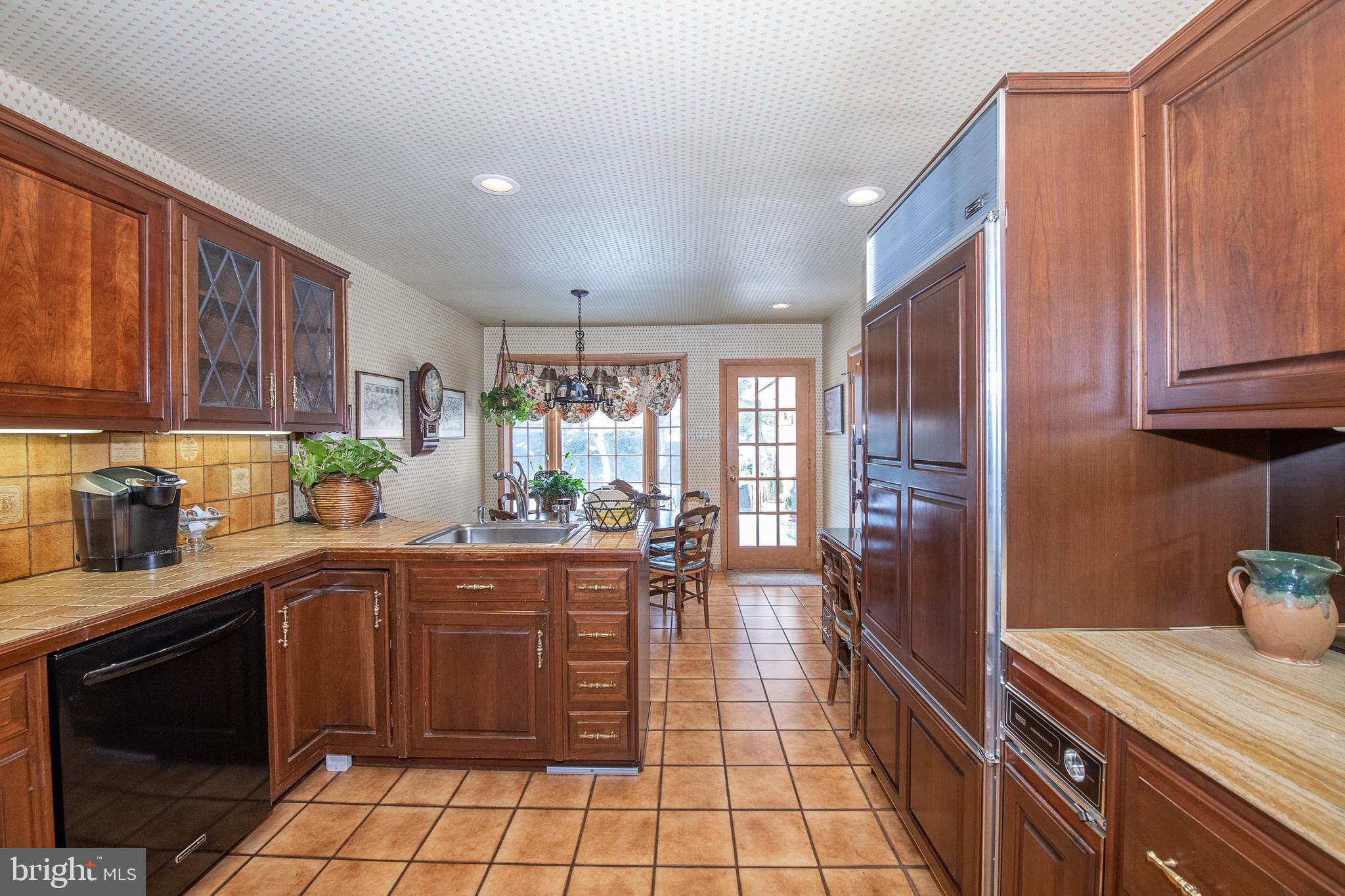 2209 North Stone Ridge Lane Villanova, PA 19085 - Photo 12 of 29 a kitchen with a sink a stove and cabinets