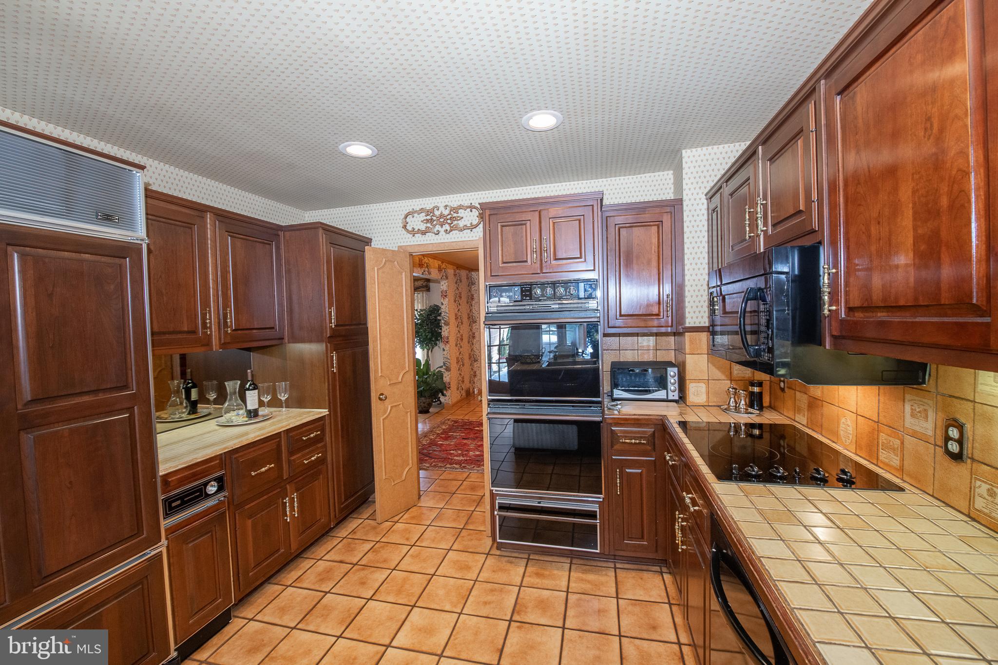 2209 North Stone Ridge Lane Villanova, PA 19085 - Photo 14 of 29 a kitchen with stainless steel appliances granite countertop a refrigerator and a stove top oven